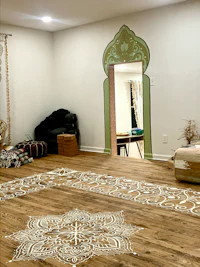a room with a mandala painted on the floor